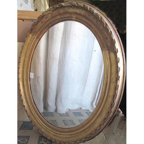 Miroir ancien en bois et platre doré, ovale, bords abimés